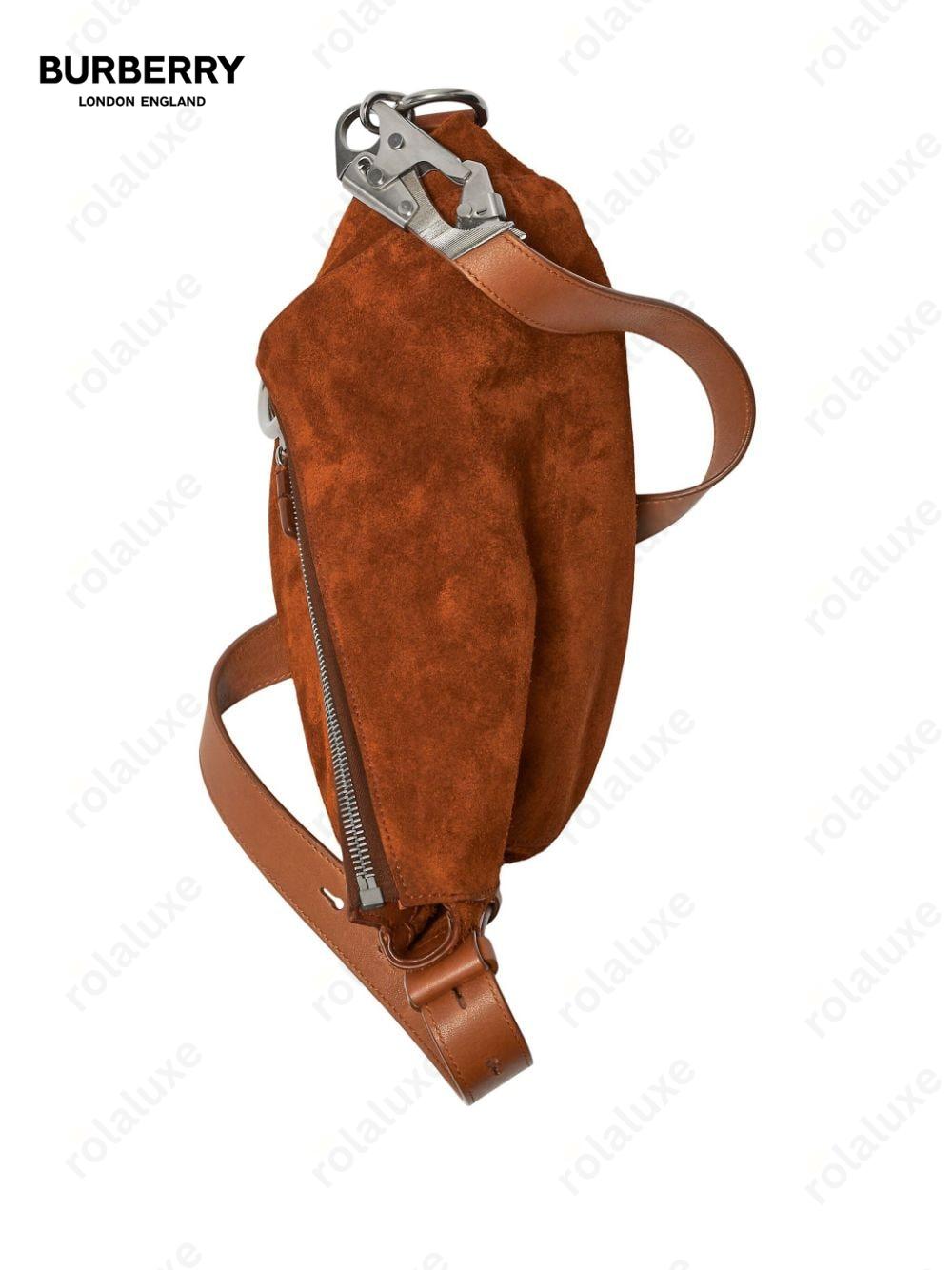 asymmetric-design suede shoulder bag