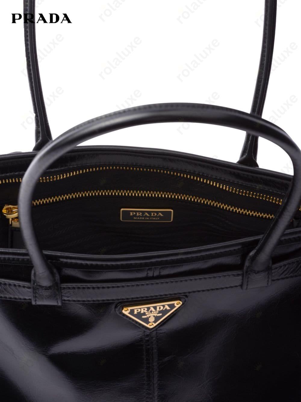 large enamel triangle logo belted handbag